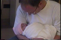 Daddy snuggles Alice